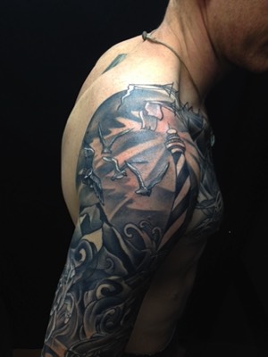  Lighthouse and ocean tattoo sleeve 